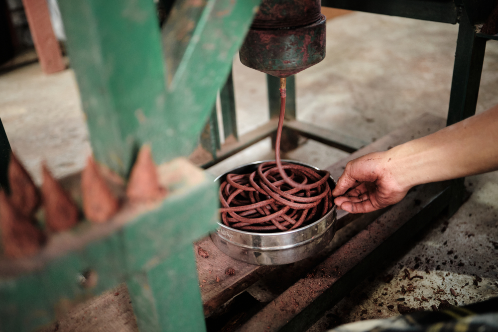 The process of shaping the mixture of the incense into string like shapes at Denzong Neynang Pe factory in Tashiding, West Sikkim. (Picture Credits: Abhishek Anil.)