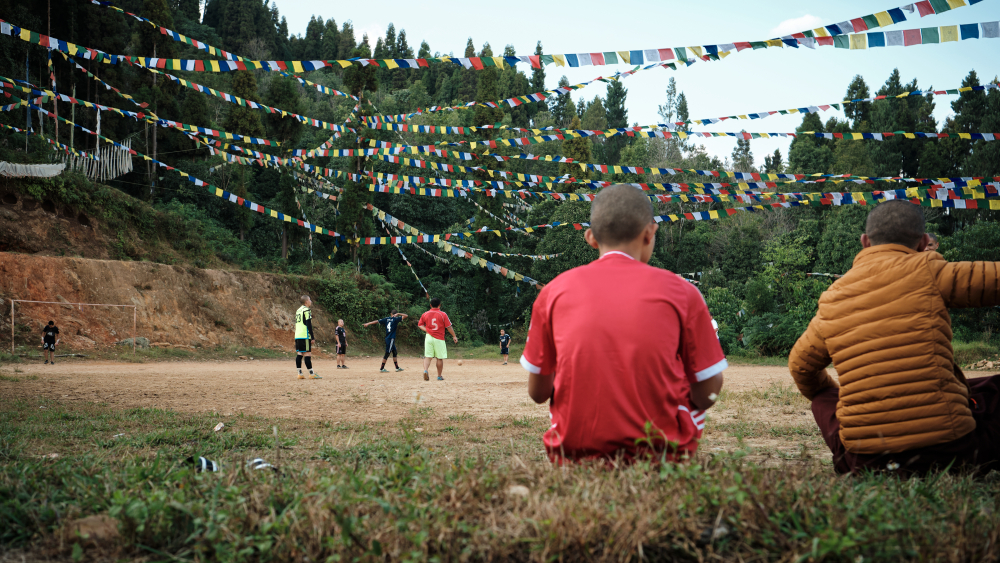 Young boys and monks play football in a ground near Rumtek Monastery. (Picture Credits: Abhishek Anil)