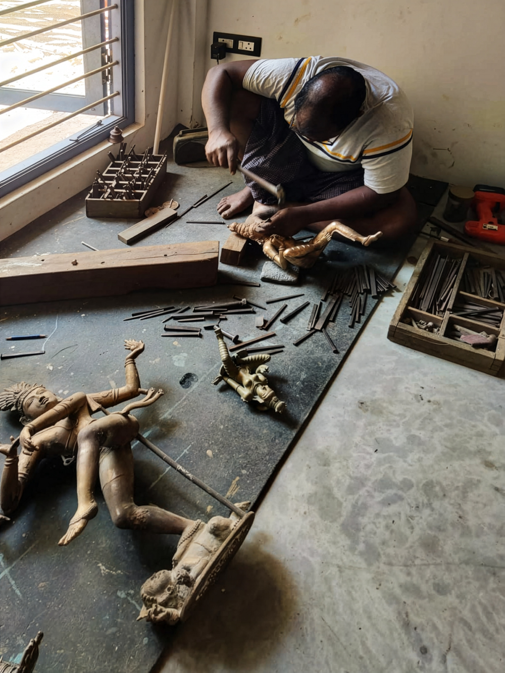 Working on the floor for several hours often leads to chronic back pain. (Picture Credits: Vasanth K)