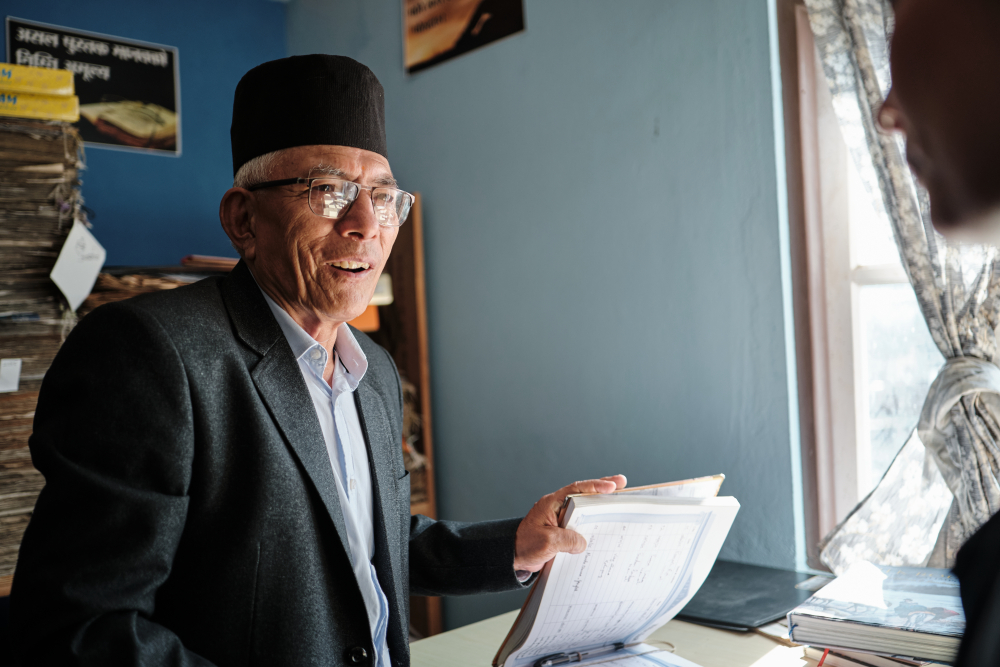 Ganesh Pradhan showing old files and records from his private museum collection in Ram Gauri Sangralaya. (Picture Credits: Abhishek Anil)