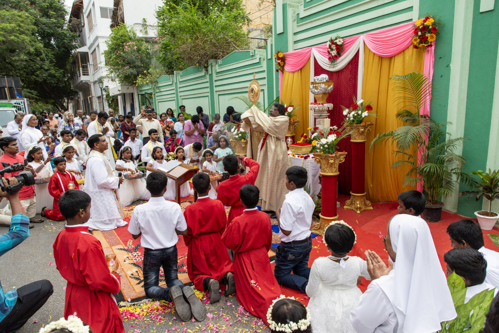 The parish priest elevates the monstrance, a gilded vessel carrying the consecrated host, and offers prayers and blessings to the gathered devotees. (Picture Credits: Pattabi Raman)