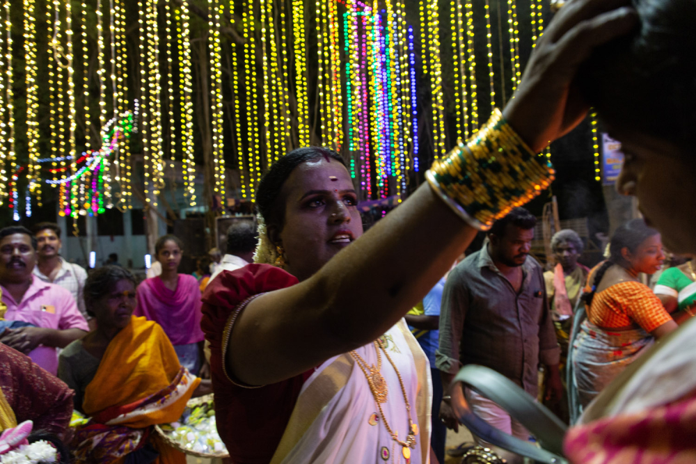 A transgender devotee offering blessings to a visitor at Pilliarkuppam. (Picture Credits: Pattabi Raman)