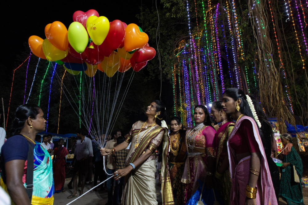 Sheetal Nayak, the transgender devotee holding the balloon, seen with other transwomen at the Pilliarkuppam festival. (Picture Credits: Pattabi Raman)