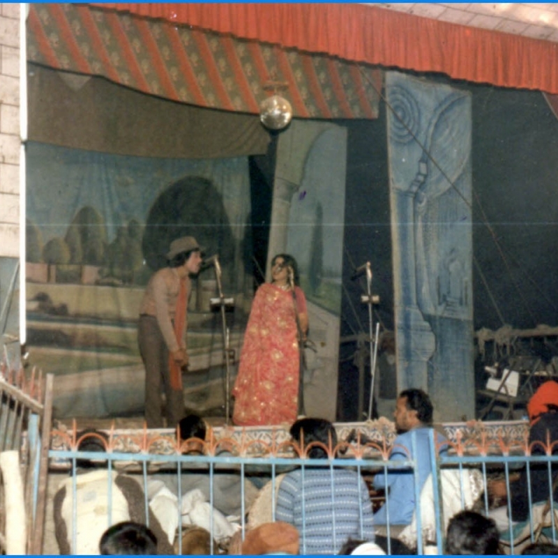 A typical nautanki performance scene from the 1950s–60s: musicians sit in an enclosure in front of the stage, there are elaborate drop curtains and painted sceneries, and actors wearing costume and make-up enact a play with dialogue and songs. (Photo courtesy: Deepti Priya Mehrotra)
