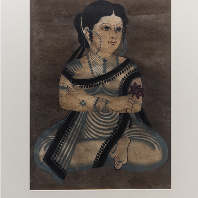 After migrating from rural areas to the urban Kali temple surroundings in Calcutta, the Kalighat patuas initially painted mythological characters. However, over time, their topics changed to include urban dwellings and secular themes: from the doings of babus and bibis to raging court cases of the time. This painting shows an urban woman sitting cross-legged, with a smile on her face, probably pondering over the day’s events (Courtesy: Darshan Shah/Weavers Studio Research Centre, Kolkata)