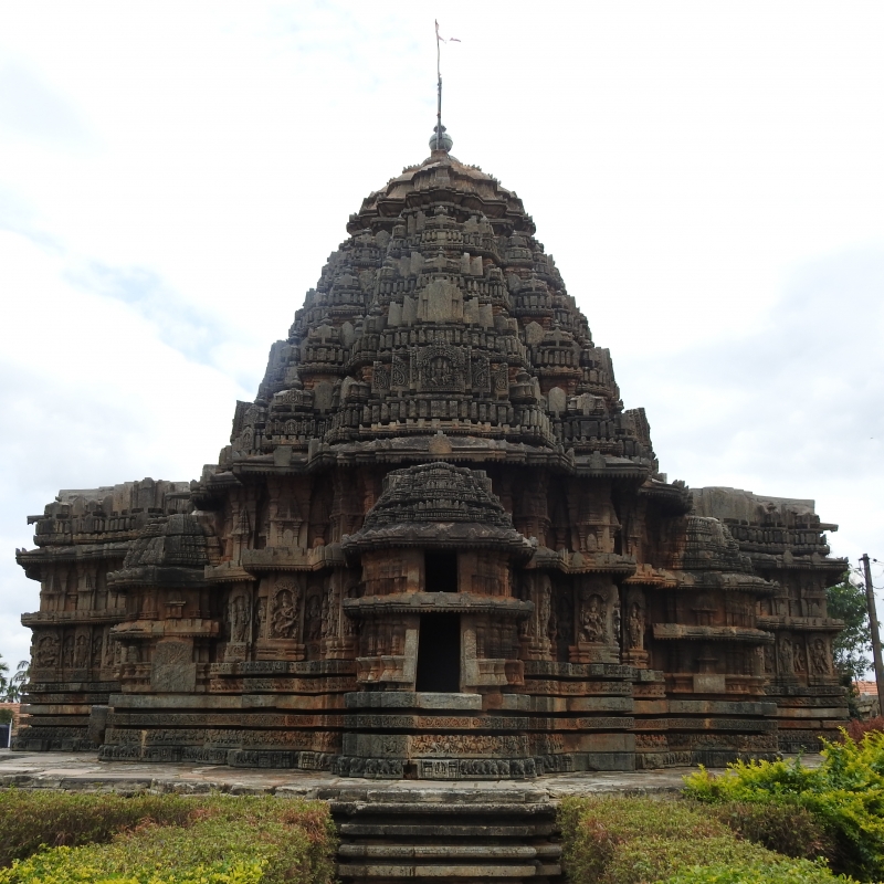 Back view of Lakshmi-Narasimha Temple, Harnahalli, with the main shrine flanked by two sanctums, and an ornate tower and a circumambulatory path (Courtesy: Poorva Salvi)