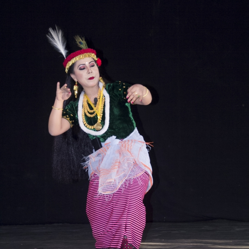A dancer performs the Khamba Thoibi dance, a thougal jagoi (dance in service of gods) performed during the Lai Haraoba (pleasing of the gods) festival, Manipur. Thoibi’s ensemble includes a phanek mayek naibi, a striped phanek with embroidered borders (Courtesy: Jawaharlal Nehru Manipur Dance Academy (JNMDA), Imphal)