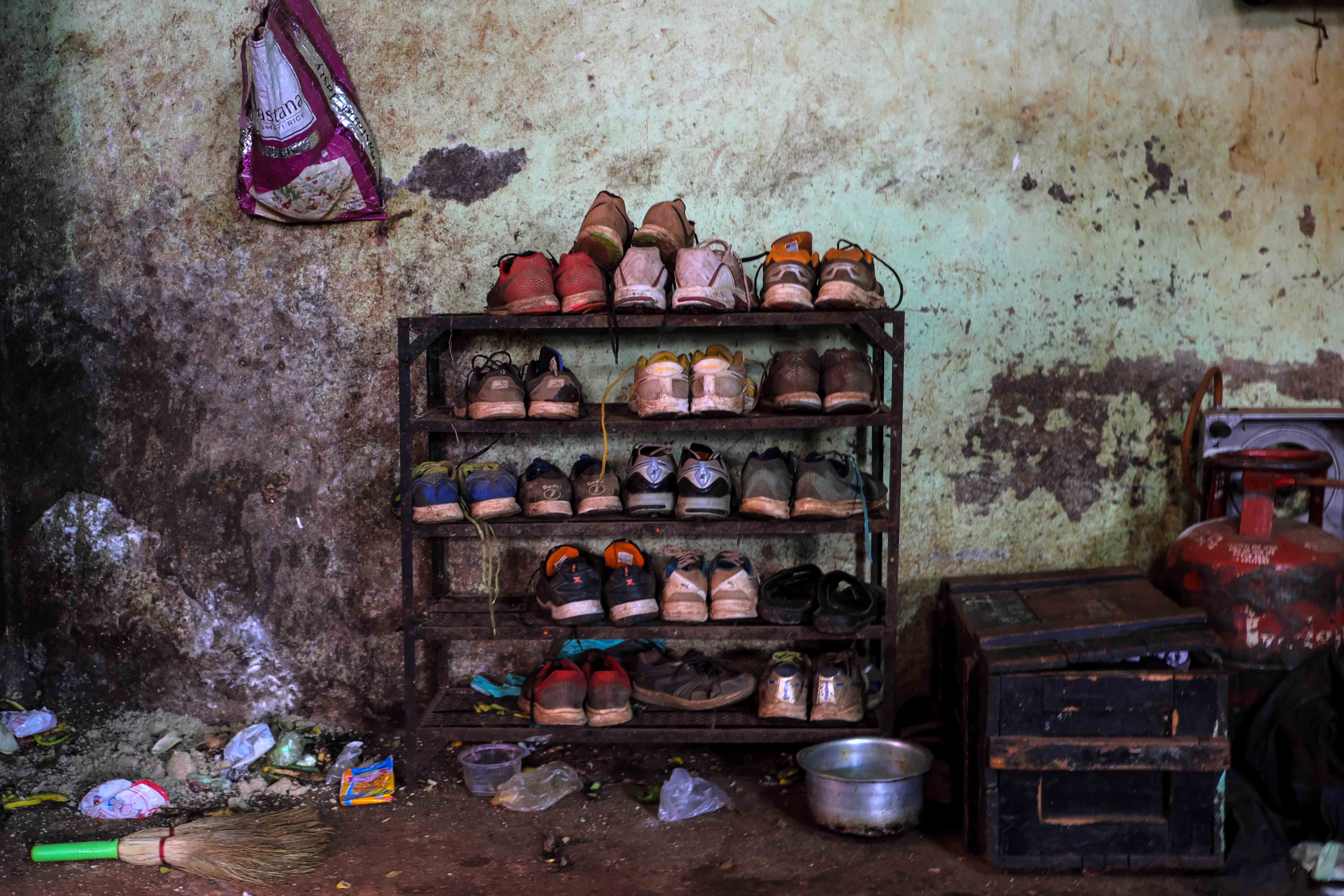 A shoe rack in the living area of Gangavesh Taleem. Running forms an important part of the daily training; starting before daybreak, it is the first thing in the everyday routine of the wrestlers. Photograph by Indrajit Khambe ©Sahapedia 
