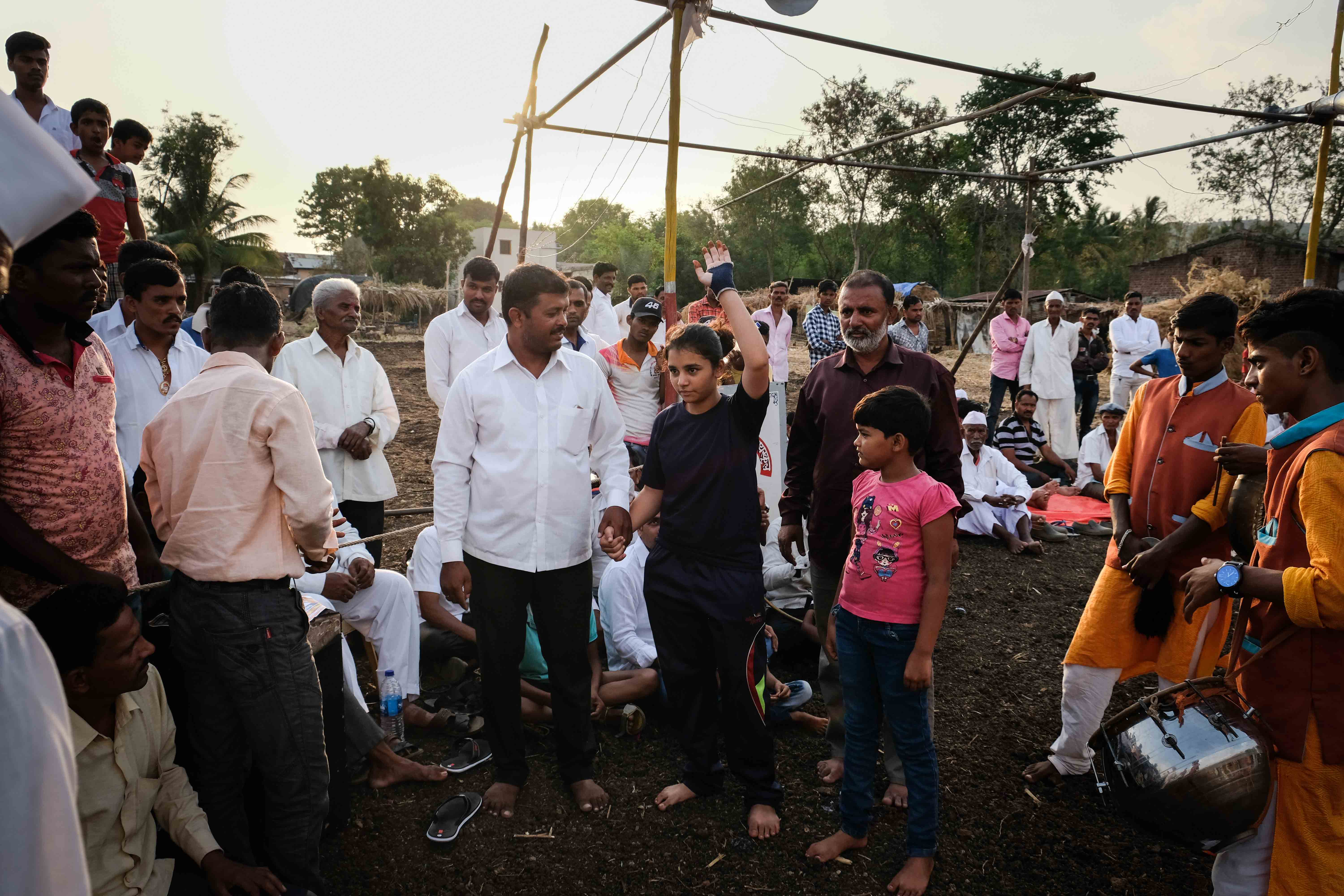 Women wrestler Sophia Mulla (age 15) being greeted by the crowd. Sophia is training to become a wrestler for the last three years. Her father used to be a famous wrestler in Satara district. She was hugely inspired by the success of Sakshi Malik who won a bronze medal in wrestling for India at the Rio Olympics in 2012. Photograph by Indrajit Khambe ©Sahapedia