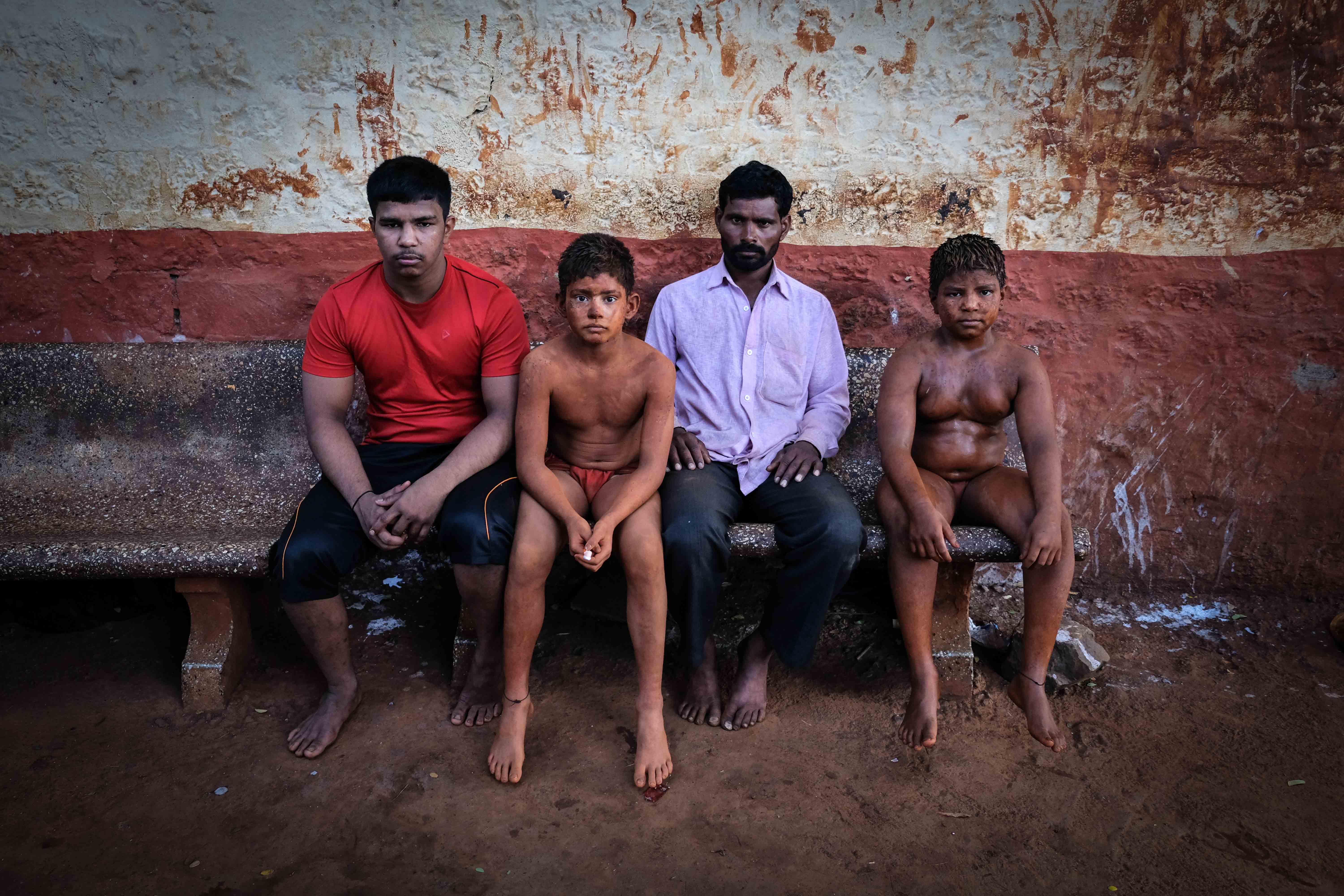 Portrait of Somnath Munde with his two sons, Tanaji and Babu, and nephew Shivaji. His two sons and nephew have been practising in Gangavesh Akhara since the last two years and Munde spends an average of 25 to 30 thousand rupees each month for their food and other expenses. Munde has 30 acres of agricultural land in Karmala village in Marathwada which is a drought affected area. I asked him why do you spend so much money on wrestling, he replied, ‘Our wrestler sons are the pride of our family which cannot be calculated in terms of money.’ Photograph by Indrajit Khambe ©Sahapedia