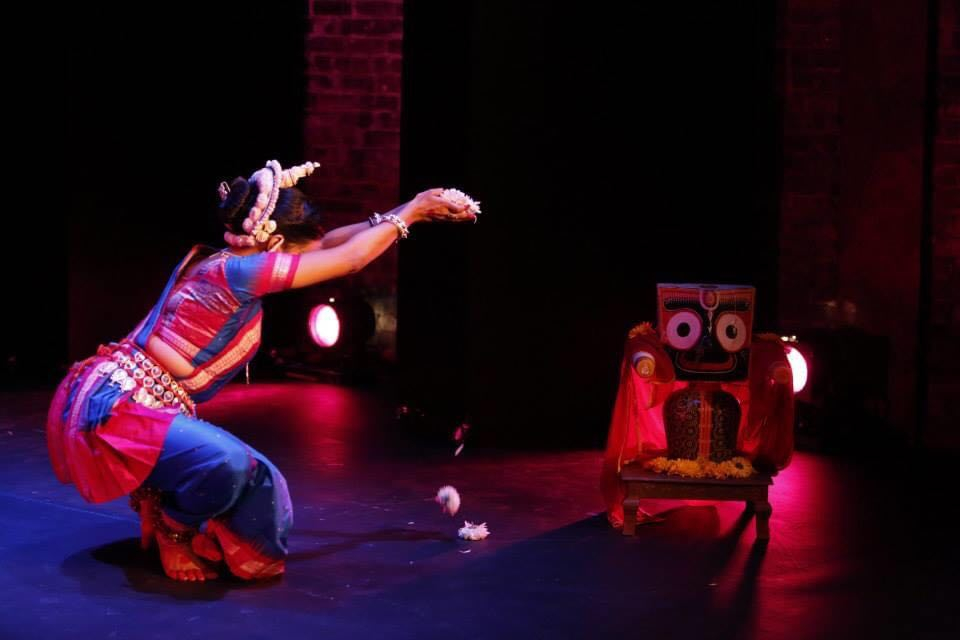 Fig. 3. Sonali Mishra offers flowers (pushpanjali) to a figure of Jagannath while performing the mangalacharan, ‘bhaje brajekamandanam’, choreographed by Bichitrananda Swain, during a performance in New York City, USA, in 2013 (Photograph by J’adore Andy Photography; Courtesy: Navatman). 