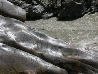 Fig. 5. A small part of the Big Boulder; Kharoshti inscription on the left upper corner is also seen, Bema Village (Courtesy: Tashi Ldawa Thasngspa, 2010)          