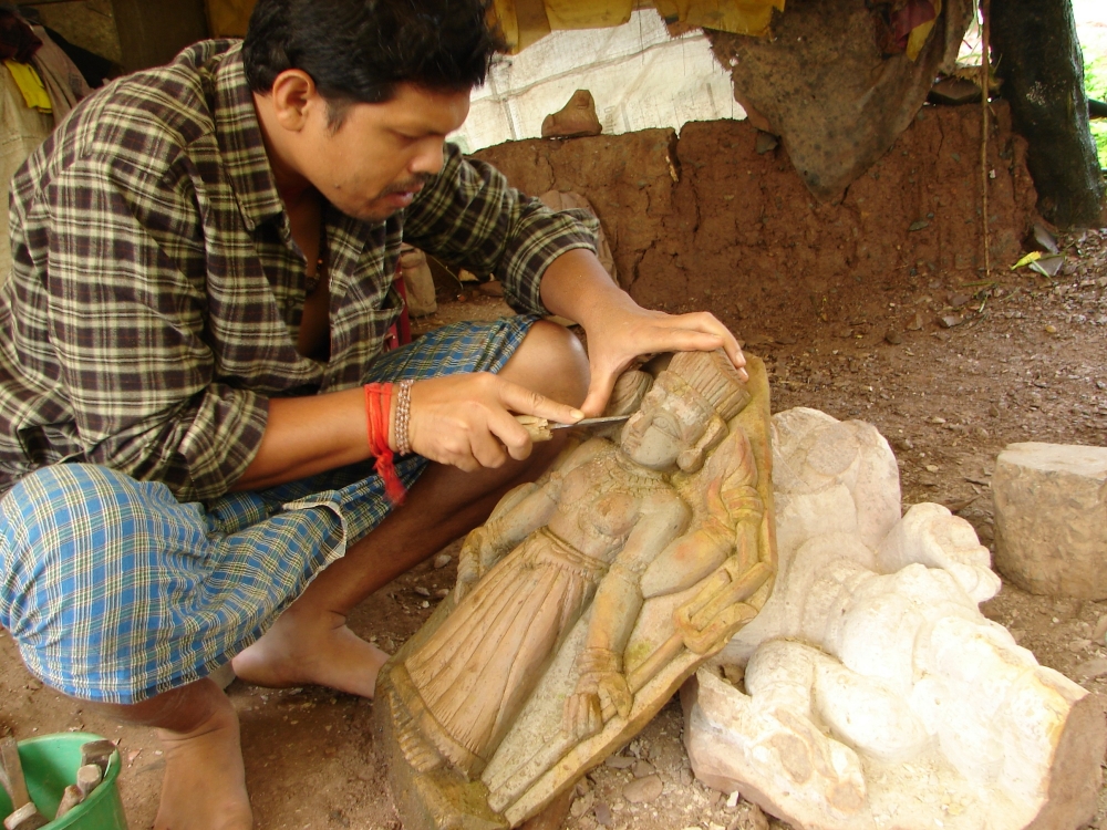 Sculptor working on a sculpture