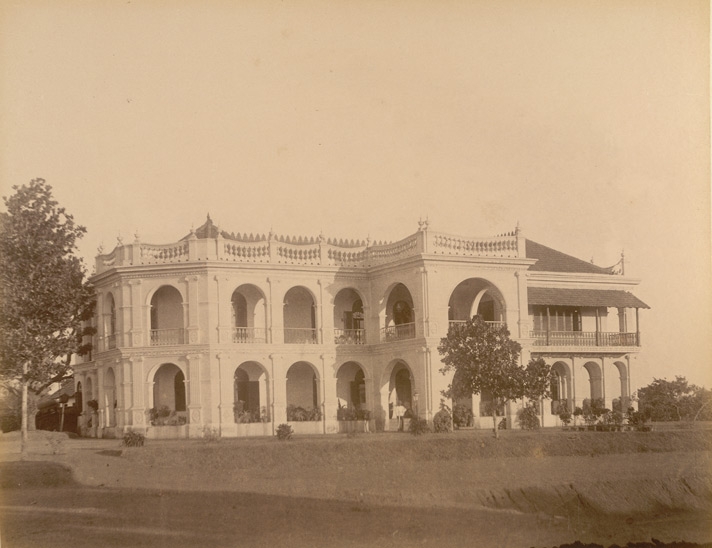 Fig. 2. Bhakti Vilas, built at Vazhuthacaud during the end of the 19th century represents shifts in native bungalows. The bungalow used as residence for Dewans outside the royal fort complex has semi-circular arches with pilasters (half-pillars projecting out of the wall surface) of a modified Ionic order (one of the classical Greek orders in columns). This is a native bungalow which includes an inner courtyard (Courtesy: Zacharias D'Cruz; The British Library Online, Shelfmark: Photo 430/45(24); Item number: 4304524)