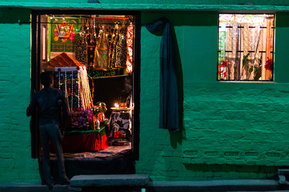 Fig. 6: A man stands outside an azakhana in Jais, Amethi on the evening of ashoora. Azakhana remains open for people to pay their respects and perform matam and majalis until the tenth day of Muharram