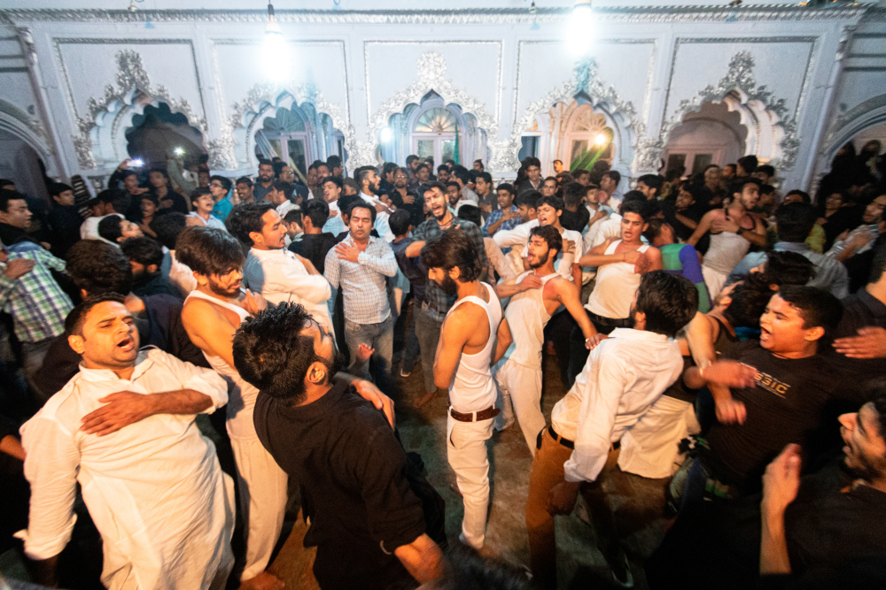 Fig. 3: Men performing matam inside an imambada in Amroha a night before Chehlum 