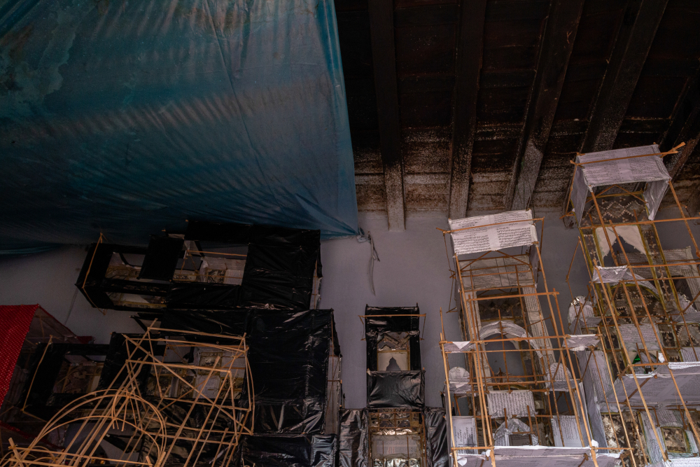 Fig. 1: Taziya structures stored in a hallway inside the Kazmain monument in Lucknow. Karigars put tarpaulin sheets to protect their work from rain 