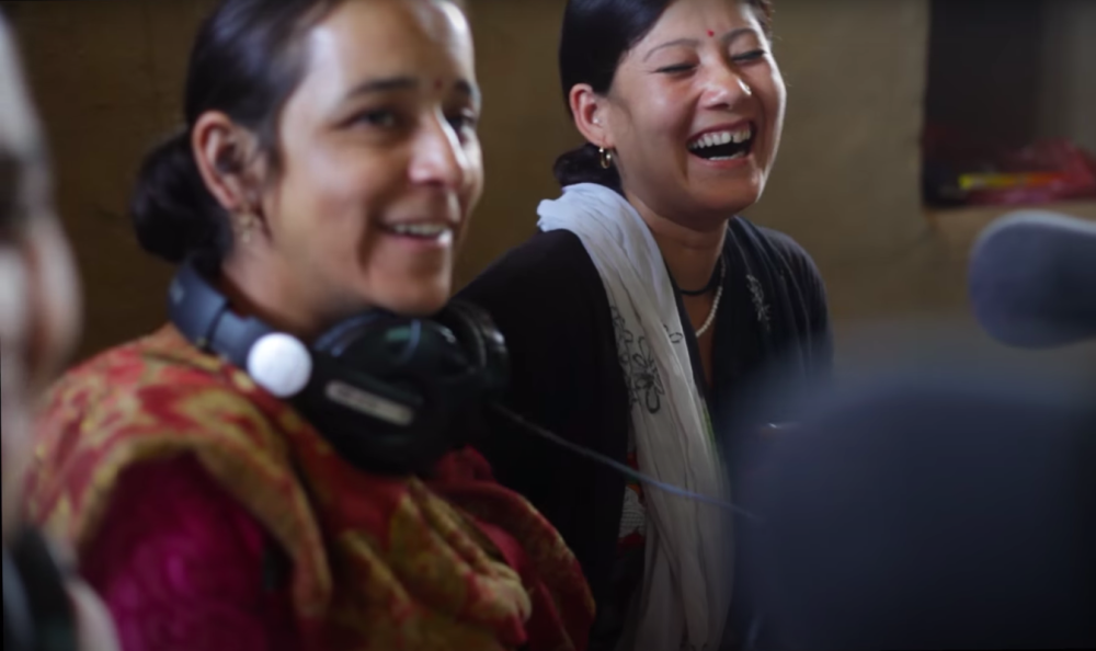 Fig. 9. Uma Negi and Poonam Badiyari, team members of Mandakini ki Awaaz, take a break from the live broadcast of the weekly women’s programme, Didi Bhuliyon ka Dagda (With our Older and Younger Sisters), to share a lighthearted moment. The weekly women’s programme, which is an hour-long special, caters to concerns and interests of women in the community, ranging from health to entertainment. (Photograph by Shweta Radhakrishnan)