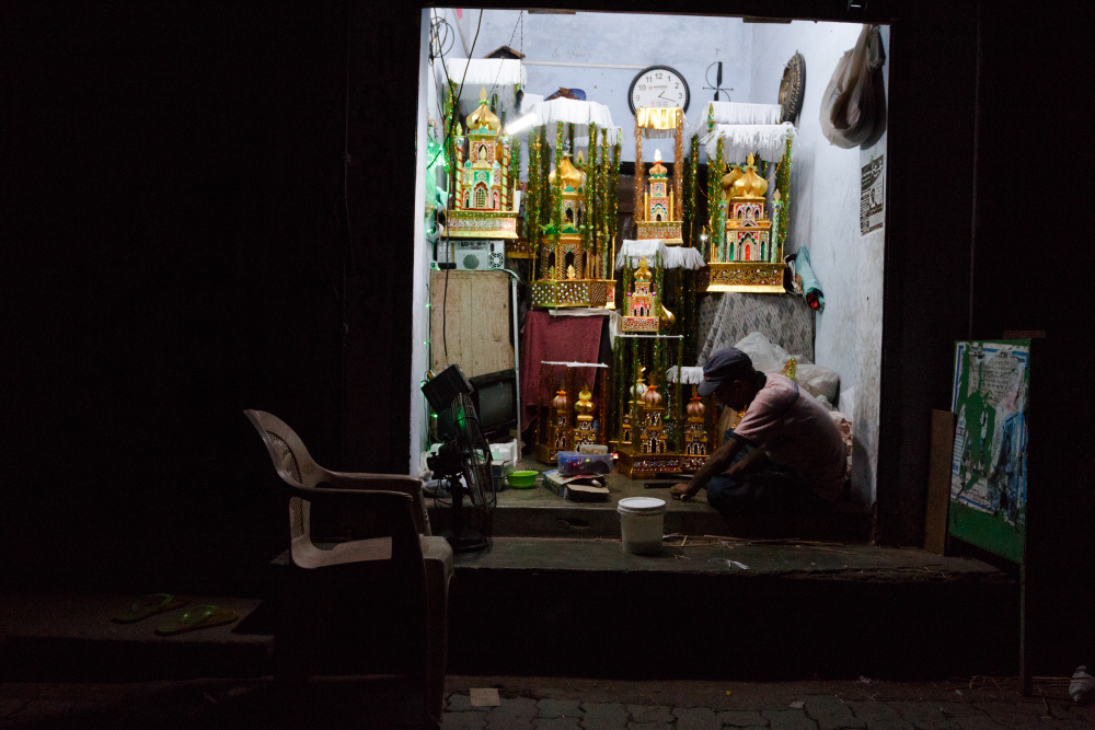 Fig. 3: A taziya maker working late at night inside his roadside shop in Lucknow’s Kashmiri Mohalla 