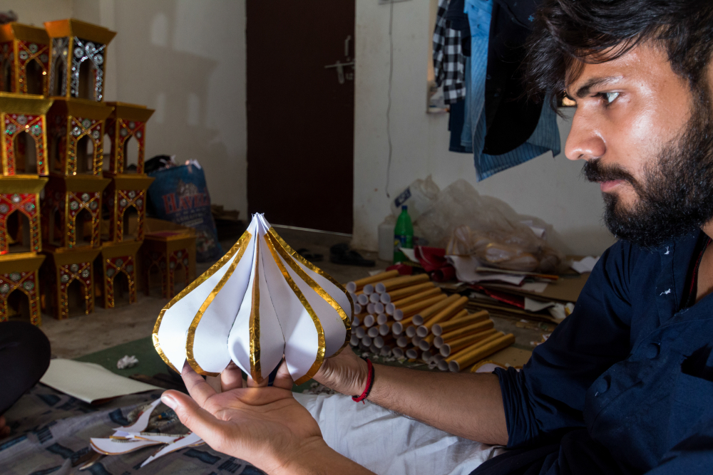 Fig. 4: A taziya maker looks at a finished kamrakhi gumzi. The kamrakhi gumzi was introduced by Sikander Mirza about half a century ago