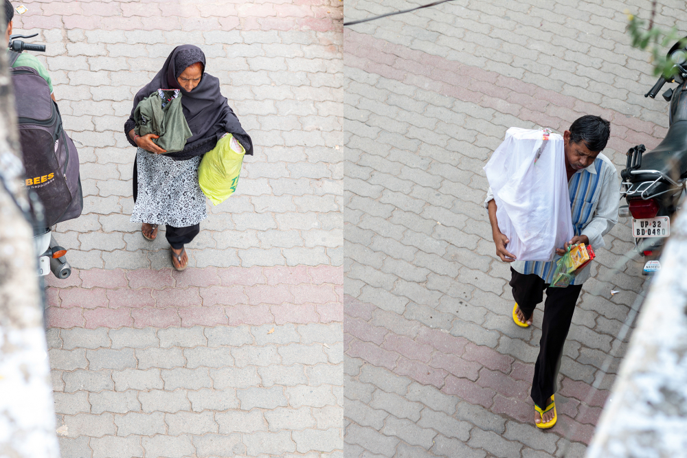 Fig. 6: A woman and a man seen carrying their taziya wrapped in a cloth after buying it from a market in Kashmiri Mohalla, Lucknow. 