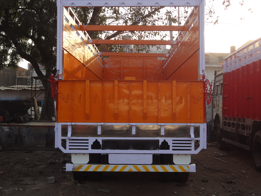 A freshly painted truck being readied for decoration. Artists who specialise in truck art take over once the truck is painted. They often maintain a diary of readymade shayaris and inscribe them on the trucks either on their own or as per specific requests of truckers 