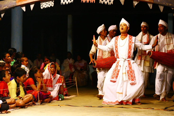 Fig 1: Bhaona as an intimate theatrical form played in namghars and sattras in order to convey religious messages. (Courtesy: WikiCommons/en.wikipedia.org)