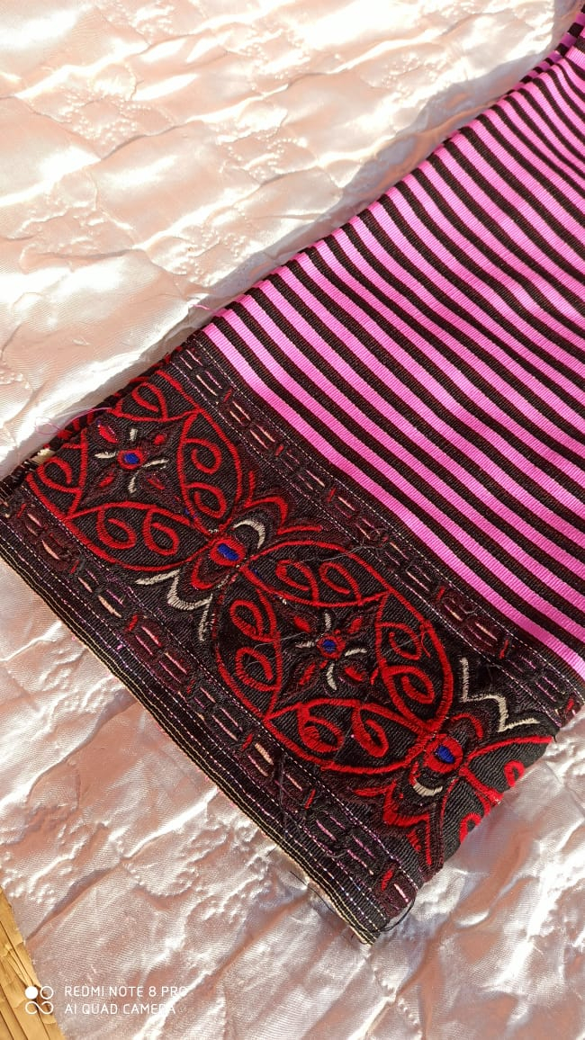 Fig. 3: The bordered embroidery dominated by black and red colours represents the traditional khoi akoibi. It has been an adapted from the older khoi mayek 