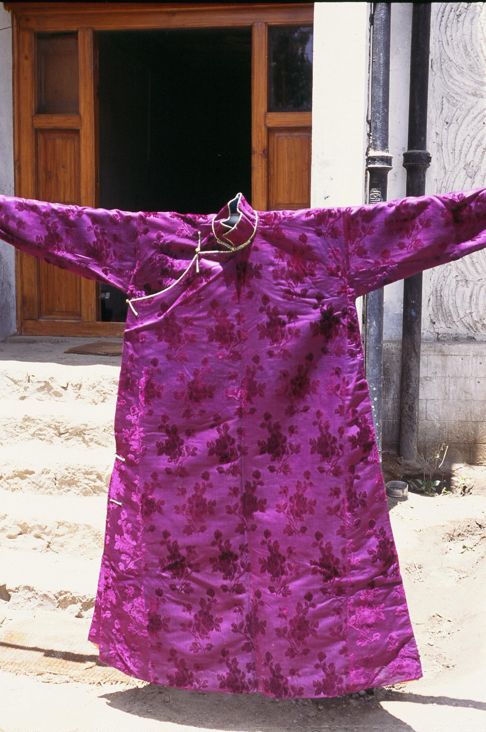 A silk-brocade robe, mid-twentieth century. This belongs to an important trading family of Ladakh, the Shangara, and is made from silk from China (Photographer: Monisha Ahmed, 1992)