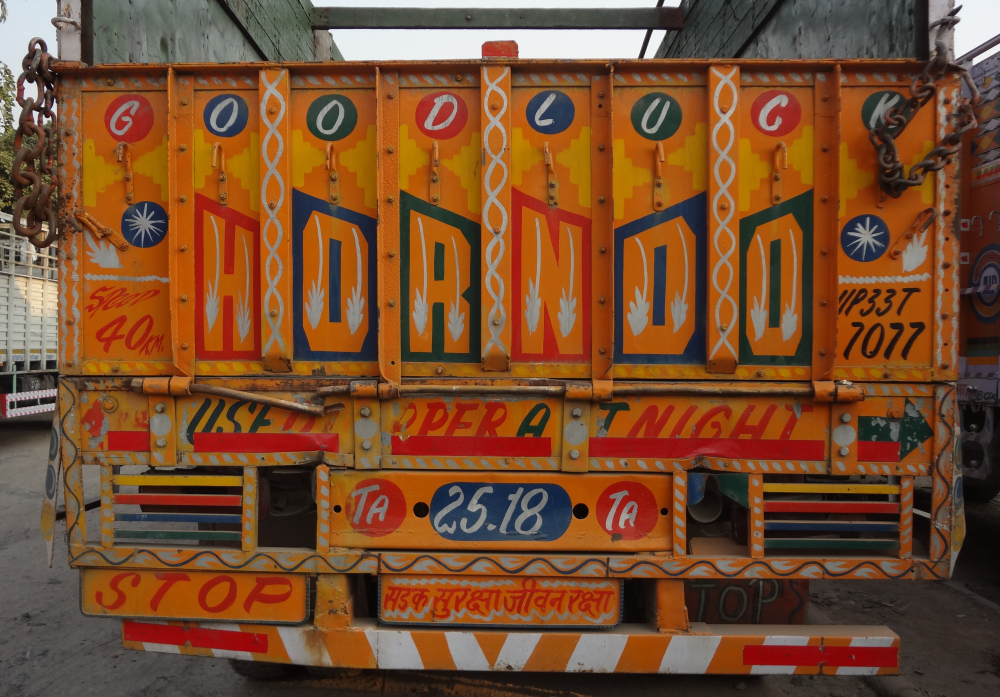 Fig. 3: A truck parked at Sanjay Gandhi Transport Nagar. Truck literature often shows concern about road safety, as seen in this picture, which asks for a horn to be honked and a dipper used at night to ensure safety 