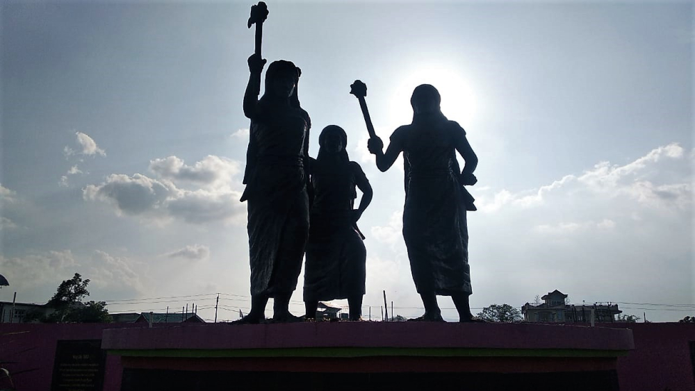 Fig. 4: A sculpture honouring meira paibis (women with flaming torches) along the Imphal riverbank in Khurai Salanthong. They are a voluntary, vigilante group who seek to protect the society and discourage antisocial behaviour. It is an indigenous grassroots movement, started in the 1970s to prohibit alcohol consumption and actively resist abuse of power and human rights violations by military forces (Courtesy: Masaco Ningthoujam).