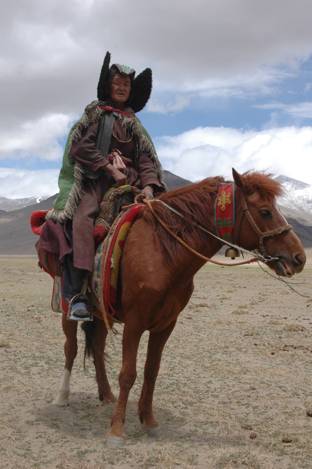 Tashi Zangmo wears her perag as she rides her horse to move from one campsite to the next, amongst the nomadic pastoralists of Changthang in eastern Ladakh.  (Photographer: Monisha Ahmed, 2006)