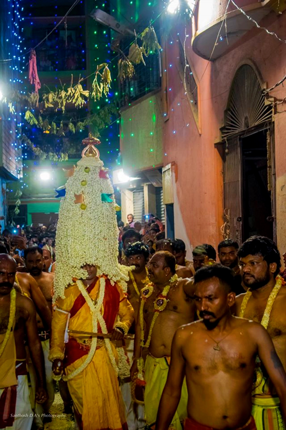 Fig.6. The main Karaga priest walking to the next location after visiting the Murahari Swami garadi mane on the Pete Karaga night (Photo courtesy: Prashanth B Vepuri, Revival Heritage Hub) 