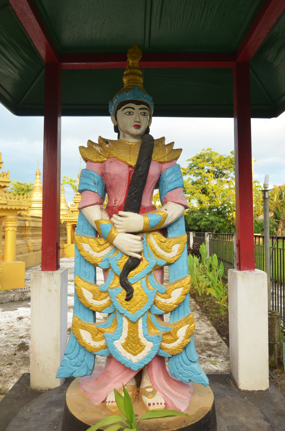 Fig. 2: A large sculpture of Vasundhara in Pariyatti Sasana Buddha Vihar, Namsai, Arunachal Pradesh. Vasundhara is the earth goddess popular among the Theravada Buddhist community of Arunachal Pradesh. According to the legend associated with her, she was the witness of the Buddha’s present and previous life’s deeds and is called forth to testify against the demon king, Mara, who claims Buddha’s seat of meditation as his own. Vasundhara is regarded as the witness of religious donations made by devotees