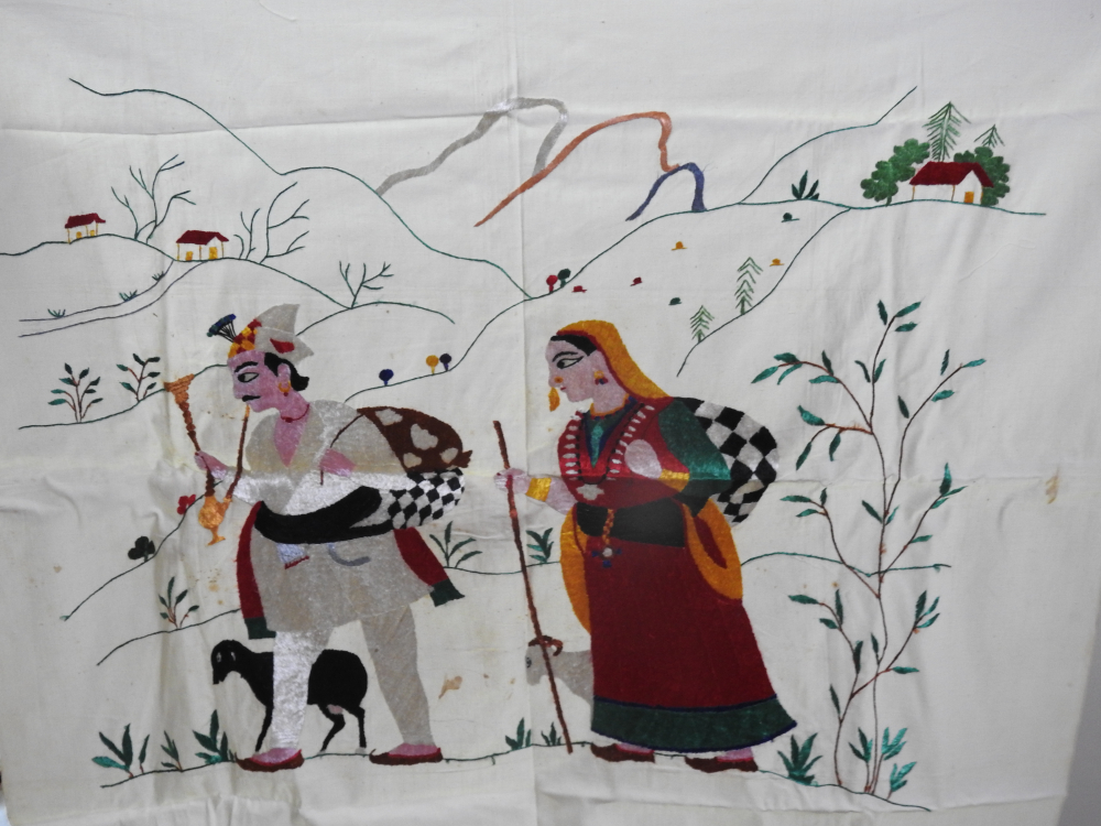 Fig. 6: Gaddi Gaddan by embroidery artist Rajinder Kumari Nayyar and miniaturist Prem Lal, made with untwisted resham (silk) thread on cotton fabric in the 1960s. This Chamba rumal was made by Rajinder Kumari Nayyar when she worked at the Chamba rumal centre set up by the Himachal Pradesh government. Gaddi Gaddan shows the Gaddi community of Chamba, a shepherd community who are among the oldest inhabitants of Chamba. Gaddi people are culturally involved and are at the centre of many Chamba folk songs as protagonists as well as performers. (Courtesy: Rajinder Kumari Nayyar)