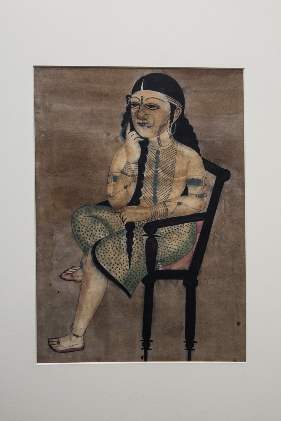 Fig 3. Kalighat paintings began to lose patronage in the early twentieth century when cheap prints filled the markets. This is a very common anonymous Kalighat painting which shows a woman sitting on a chair and thinking (Photo courtesy: Darshan Shah/Weavers Studio Research Centre, Kolkata)  