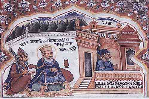 Sri Guru Nanak Dev Ji (centre) dressed in blue robes at Guruduara with Bhai Mardana (right) Ji and Bhai Bala Ji (left); Photo: Photographed by Sohan Singh Khalsaji/Wikimedia Commons