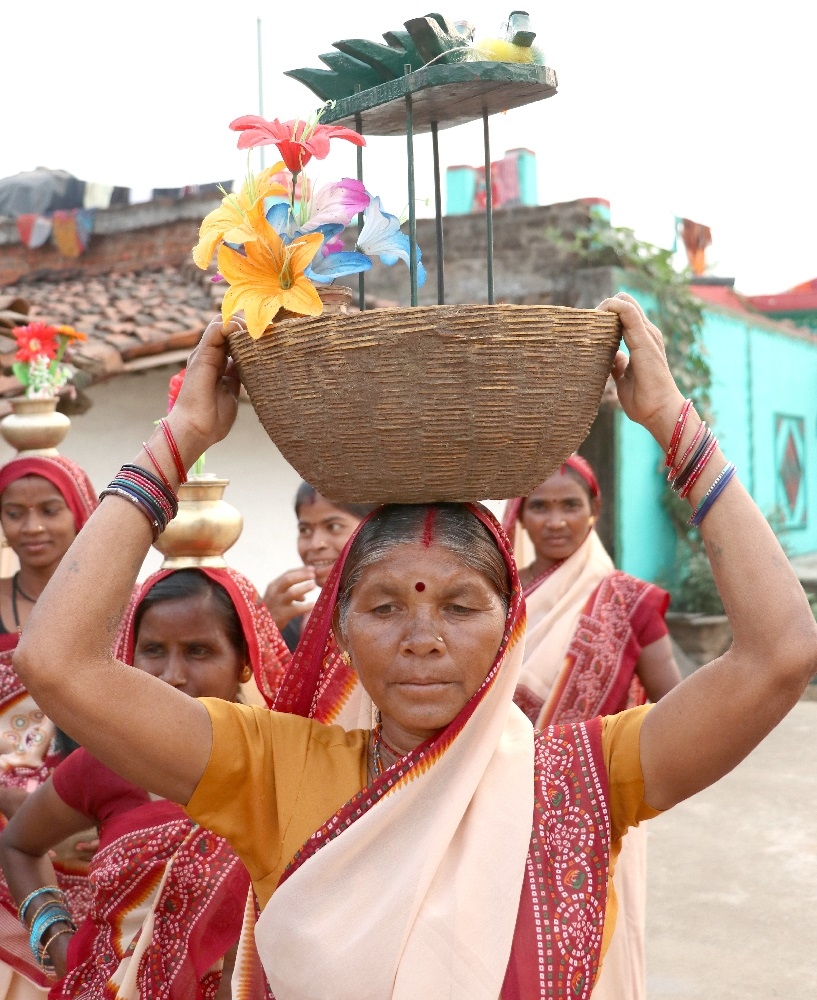 Woman Holding the Sua Basket over her Head