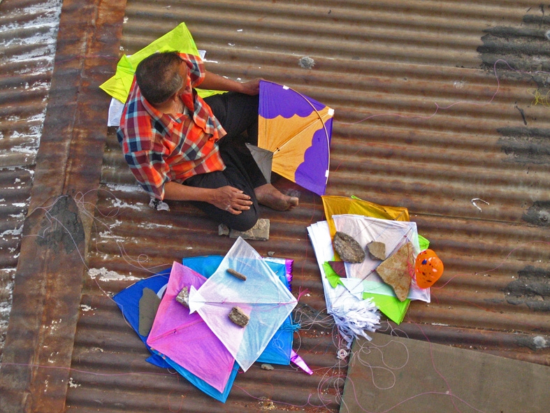 kite flying in india, makar sankranti, uttarayan, Kite sorting on roof of a house, Meena Kadri Flickr