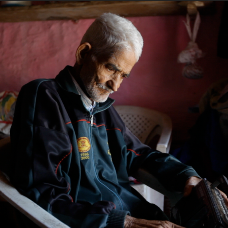 A community member from the catchment area of Mandakini ki Awaaz tunes his radio set to 90.8 MHz to listen to the daily broadcast of the community radio station (Still from the film, A Radio of One’s Own)
