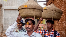 During the Warlis’ life-cycle rituals such as joli-lagin-dis (birth-wedding-death), everything is anointed with mohua daru.  Mohua daru is also part of the homecoming ritual of their kuldevas (household deities), as seen here. Warli men from Nashik district, whose gods are believed to share kindred relations with those of Palghar district, carry Hirva Dev, wrapped in a red cloth, and the other kuldevas in a karandi (basket). (Courtesy: Namrata Toraskar)